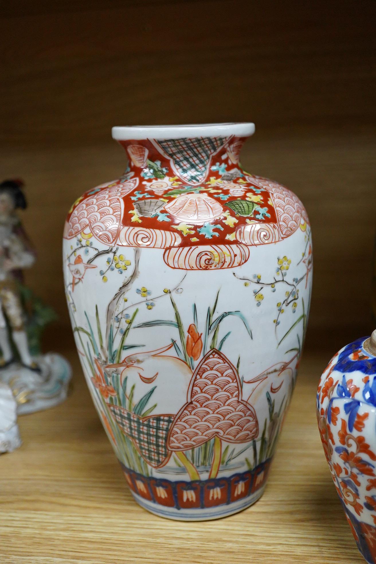A Japanese green Kutani vase, a pair of Imari vases and smaller vase (4)